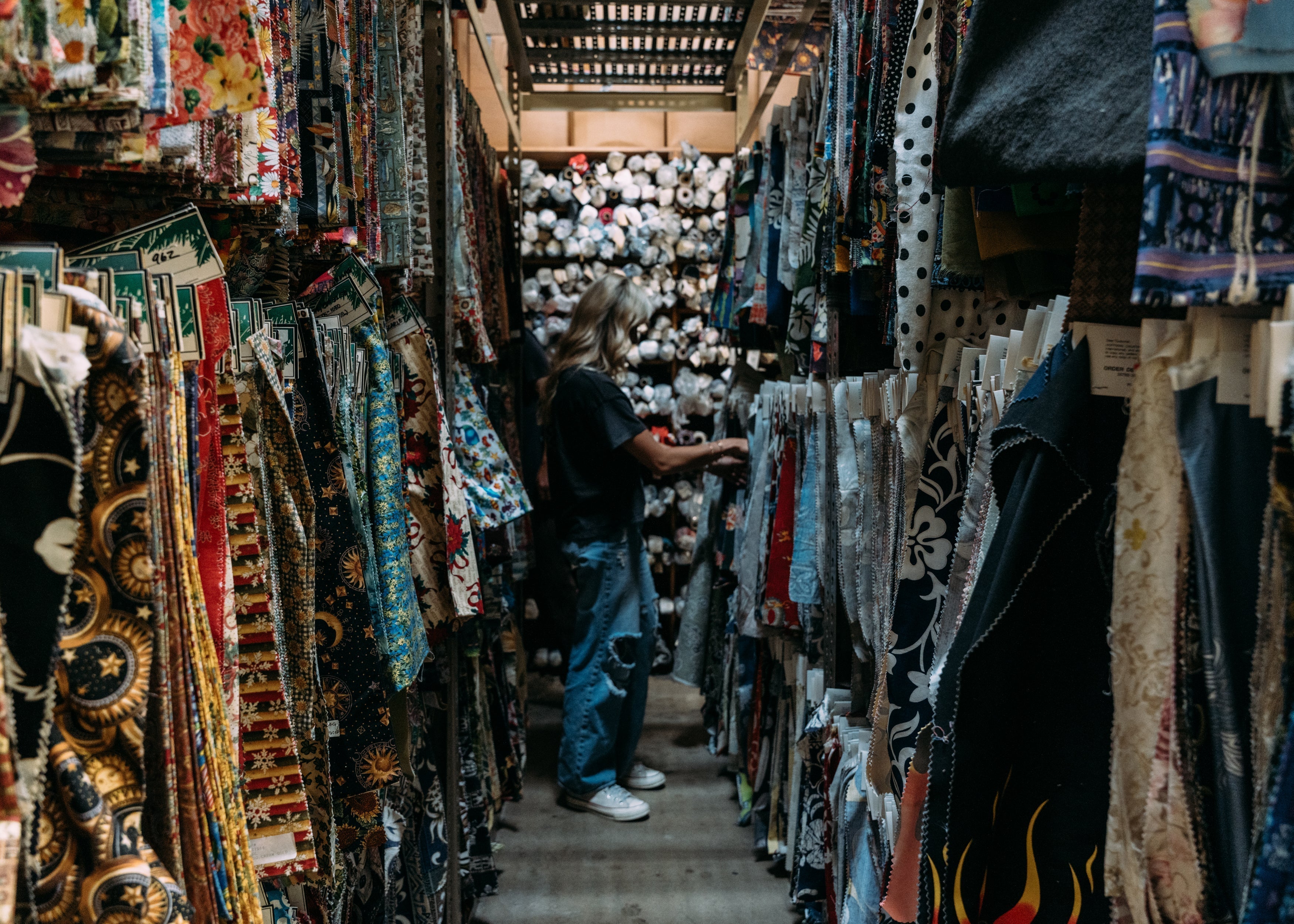 Indie Hoffman exploring the vaults at Hoffman Fabrics for inspiration for her latest swimwear and clothing collaboration with Sisstr